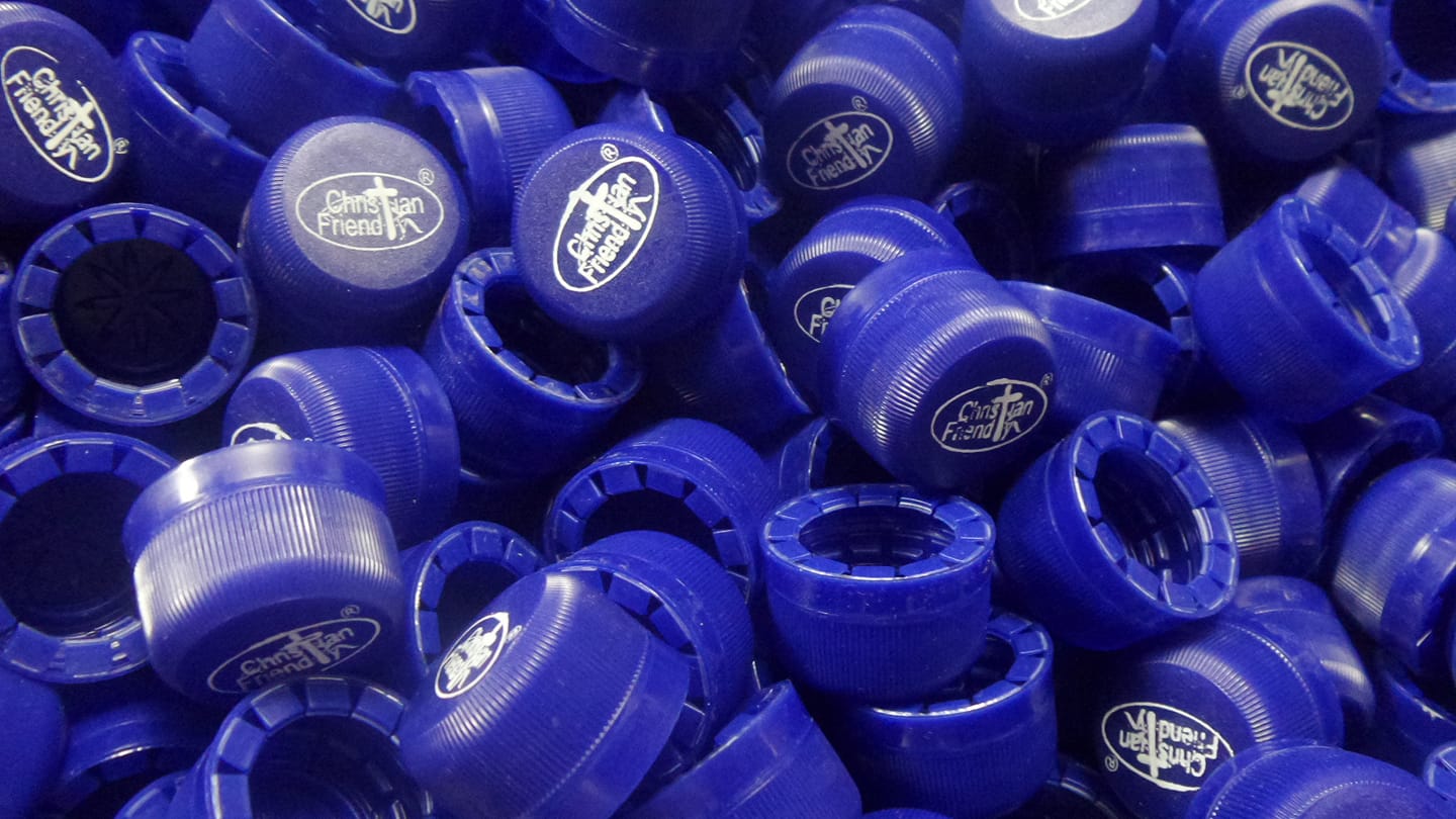 Our beautiful logo on blue caps.